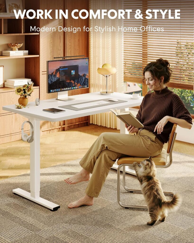 FlexiSpot EL1 electric standing desk with white frame and woman working at it in a modern home office setting.