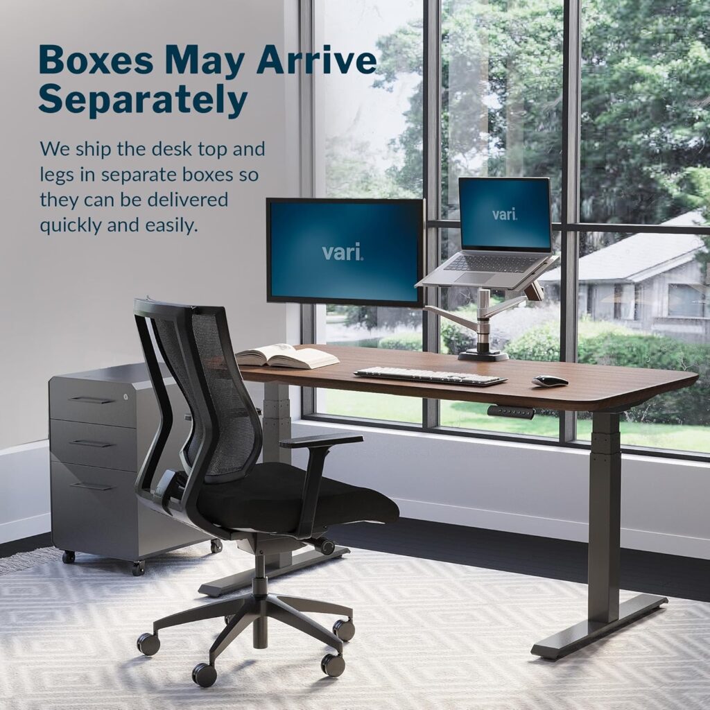 VARI Electric Standing Desk with adjustable height frame and ergonomic office chair in a modern home office.